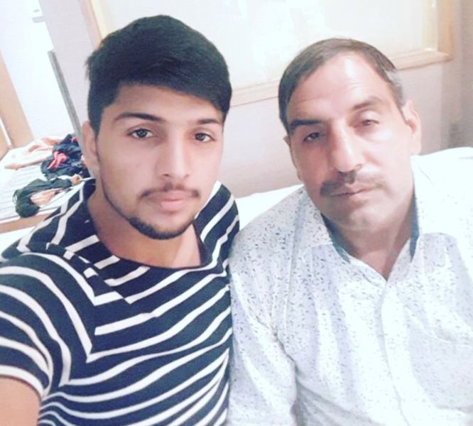 Nitesh Kumar with his father Sanjay Kumar (right)