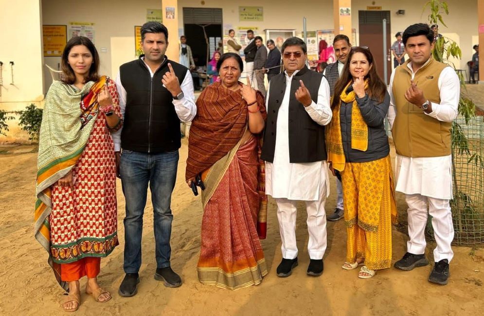 Rajendra Singh Yadav with wife (Cente) and sons Tribhuvan (Left) and Madhur (Right) with their wives