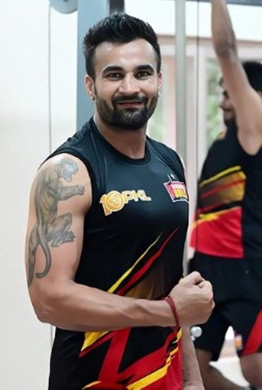 Ran Singh's tattoo on his left bicep