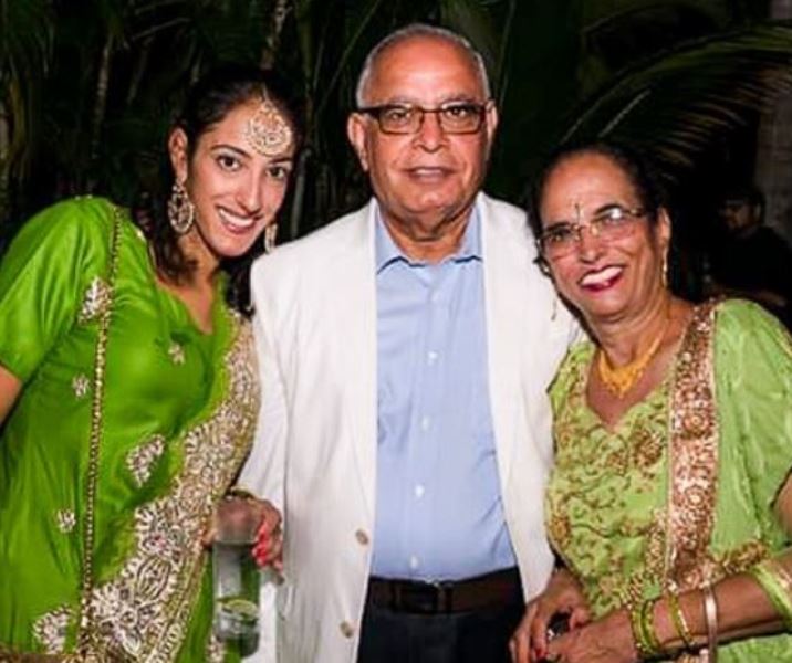 Rena Malik with her parents