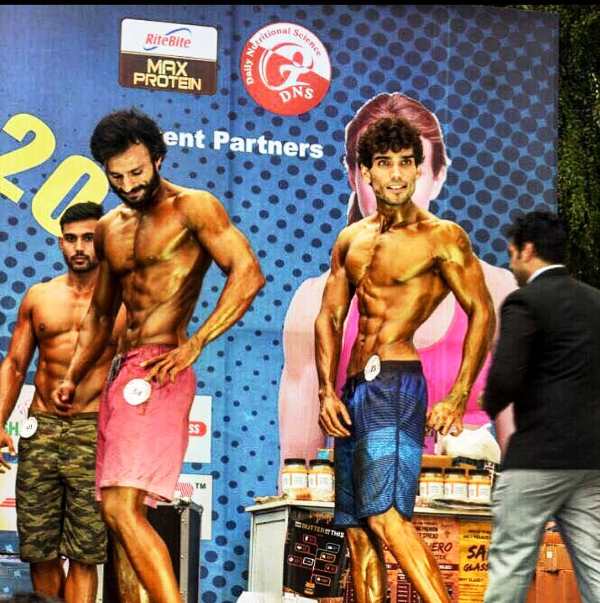 Rishabh Sawhney competing in a men's physique competition