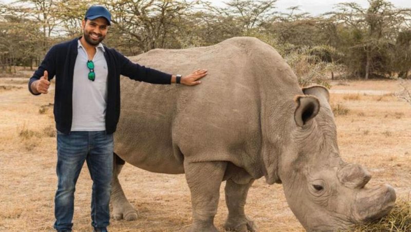 Rohit Sharma posing with a Rhino