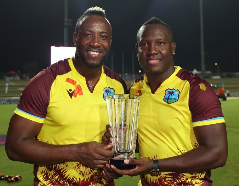Rovman Powell with Andre Russell (left)