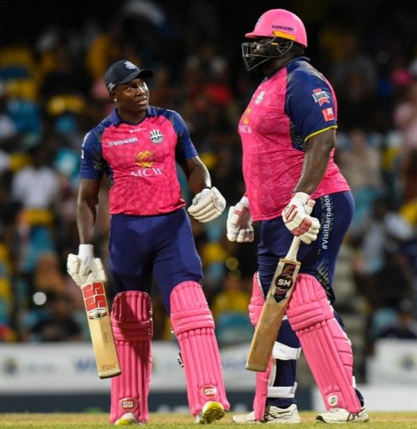 Rovman Powell with Rahkeem Cornwall (right) while playing for Barbados Royals