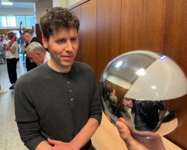 Sam Altman in front of the Tools For Humanity iris-scanning orb