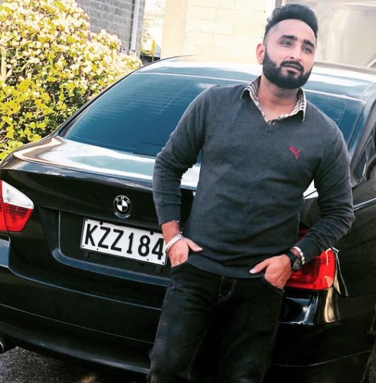 Savi Kahlon posing with his BMW