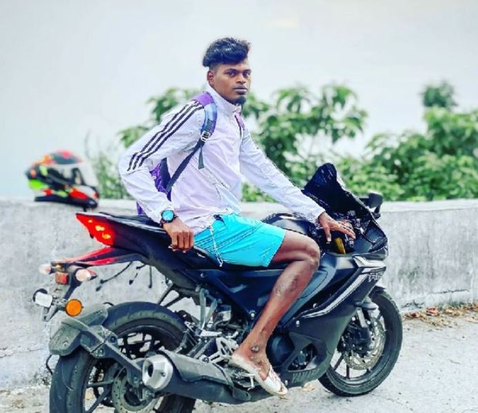 Sudhakar posing with his bike