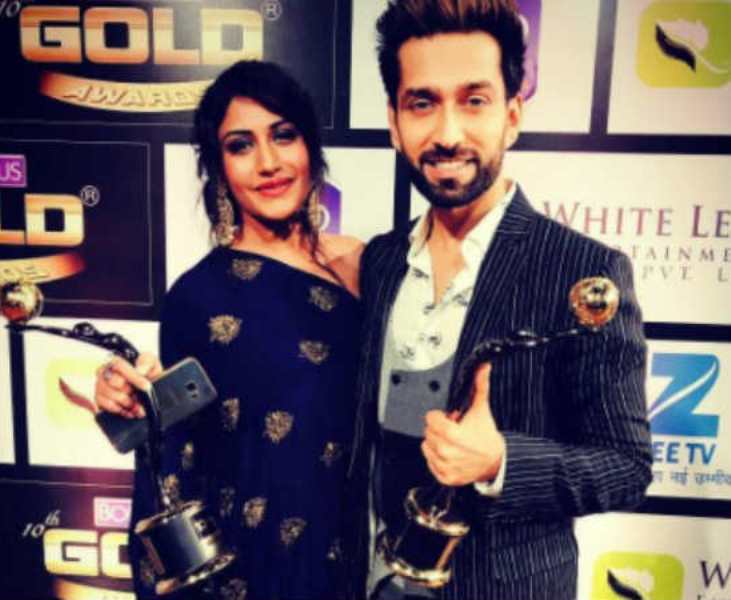 Surbhi Chandna with Nakuul Mehta after receiving Best Onscreen Jodi Award at the Gold Awards 2017