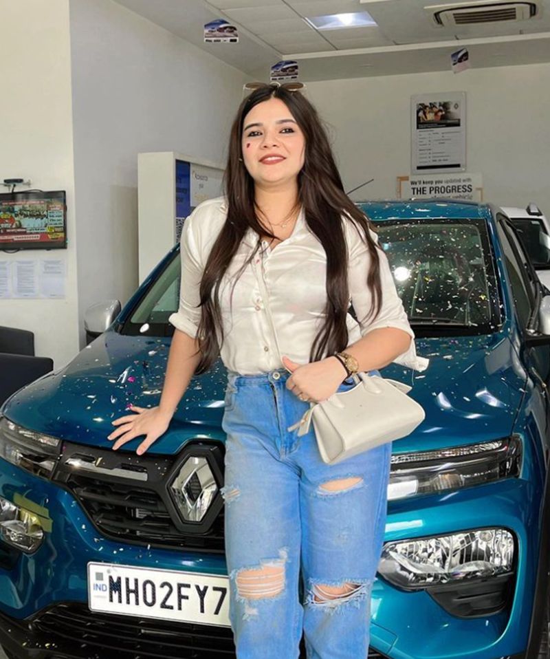 Swati Mishra posing with her car
