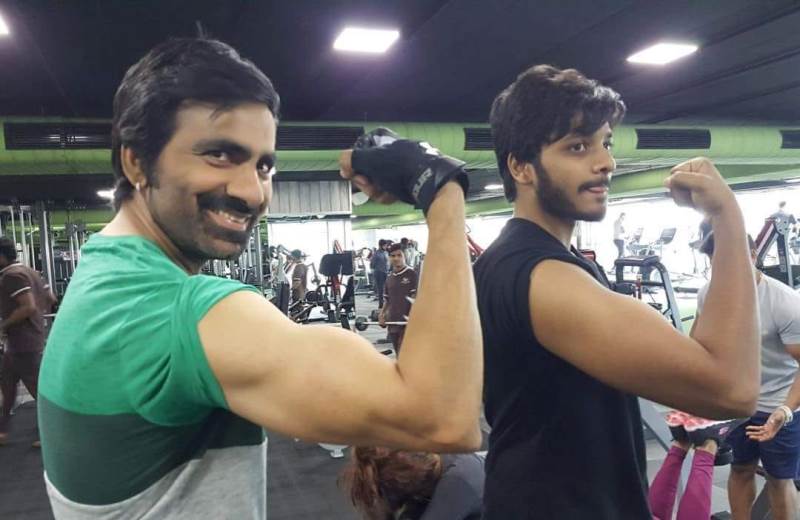 Teja Sajja with Ravi Teja working out in a gym