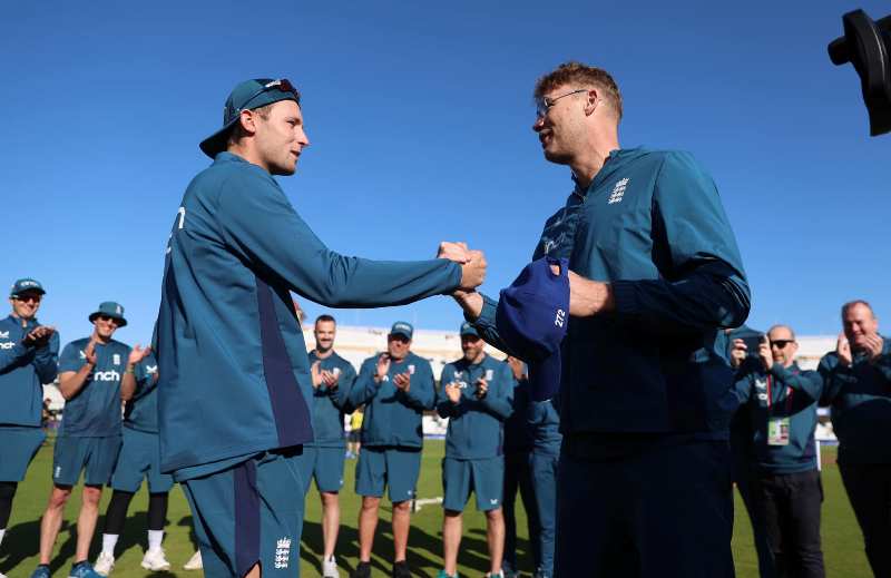 Tom Hartley being given his ODI cap for England by Andrew Flintoff (right) on his debut