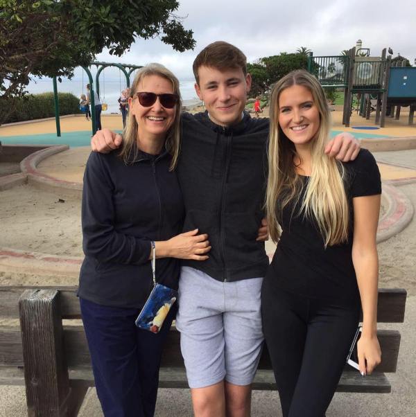 Tom Hartley (middle) with his mother and sister (right)