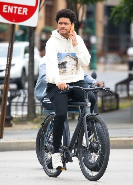 Trevor Noah riding his electric bike