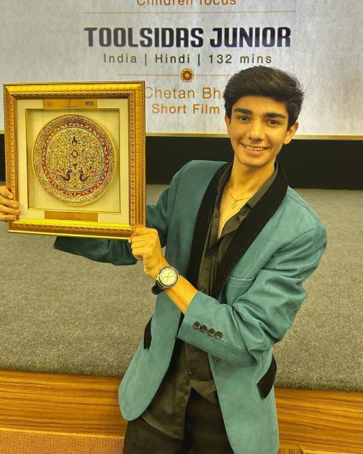 Varun Buddhadev holding the NFDC Award