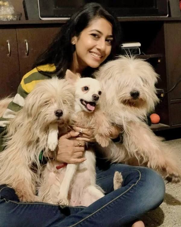 Via Roy Choudhury with her pet dogs