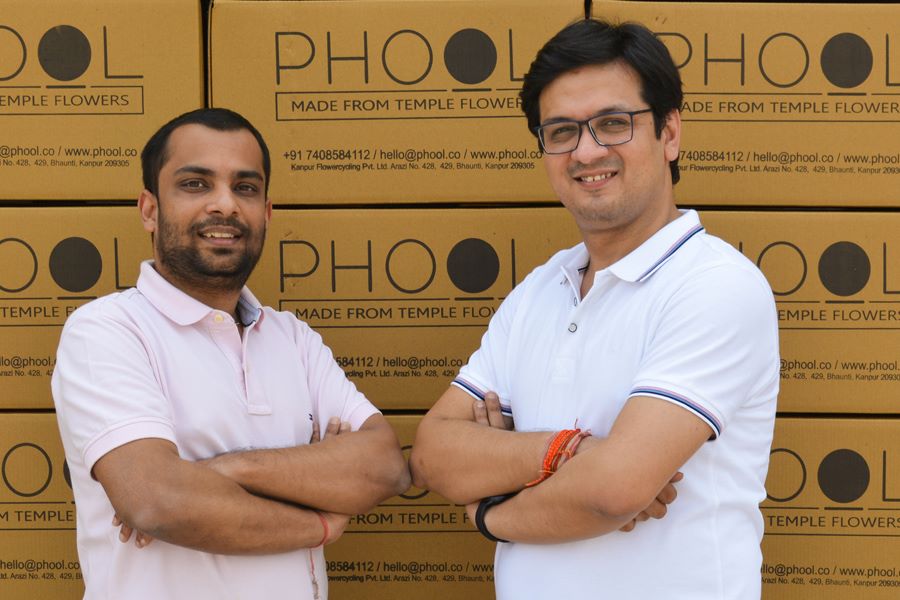 Ankit Agarwal with Prateek Kumar standing in front of the goods of Phool