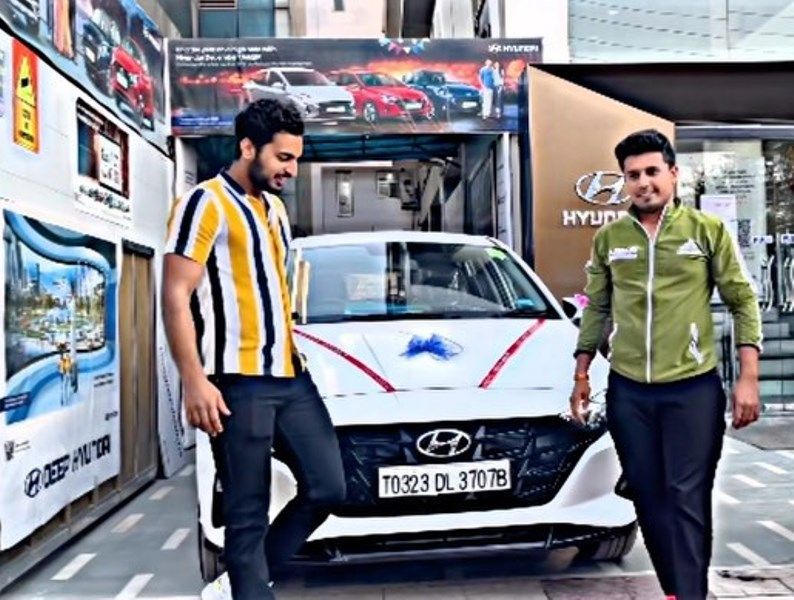 Ankit Malik (right) with his car