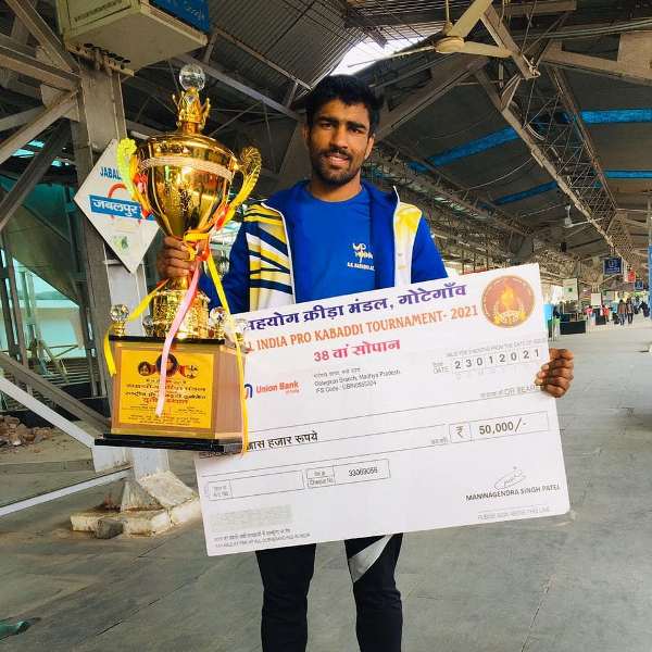 Anuj Kumar posing with the trophy at 38th All India Men Kabaddi Championship