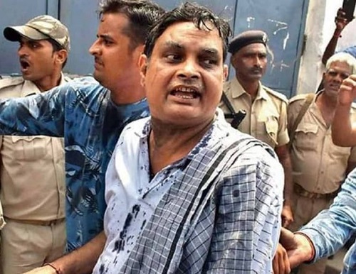 Brajesh Thakur after black ink was thrown on his face by a woman