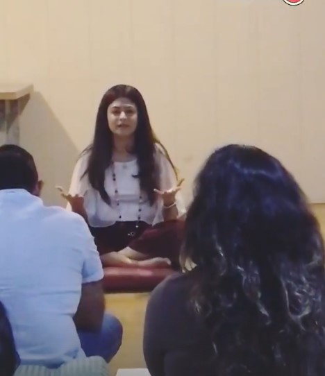 Devina Badhwar while delivering a spiritual workshop