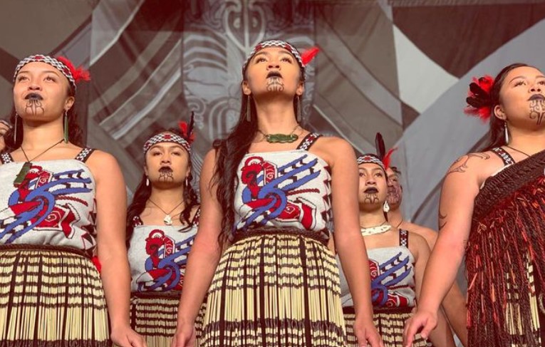 Hana-Rawhiti Maipi-Clarke while performing a stage show for her community in 2019