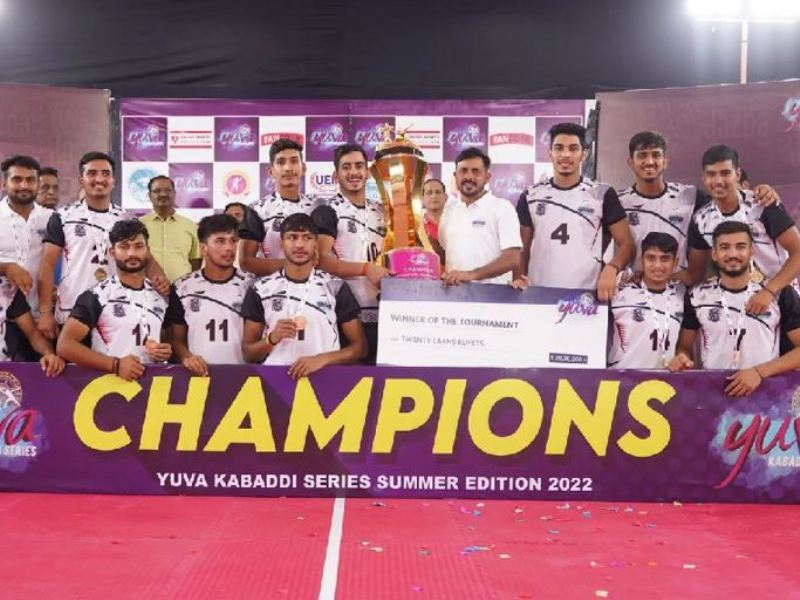 Manish Dhull (holding the trophy from left) posing with his team after winning the tournament