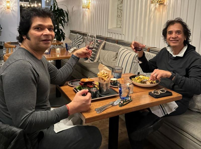Rakesh Chaurasia enjoying red wine with Zakir Hussain