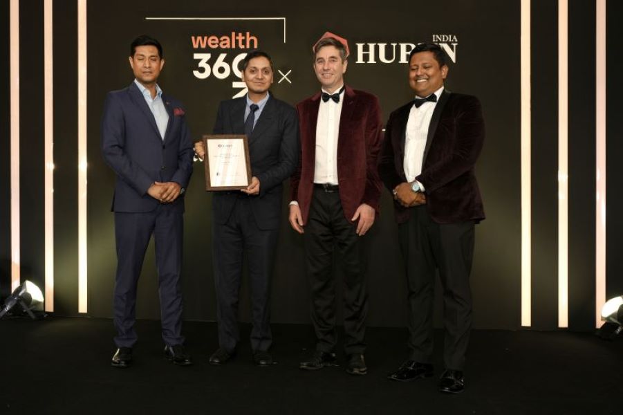 Rikant Pittie holding Hurun India Entrepreneur of the Year Award