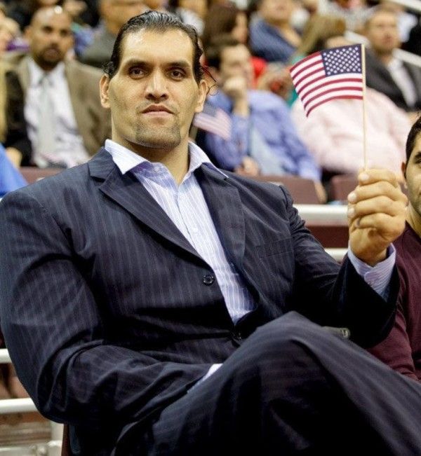 The Great Khali holding the American flag after becoming a US citizen
