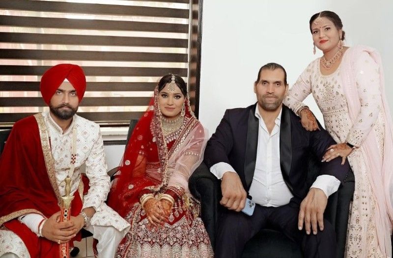 The Great Khali (in black) with his wife, Harminder Kaur(standing), brother-in-law, Harkirat Harry, and his wife, Karina Kainth
