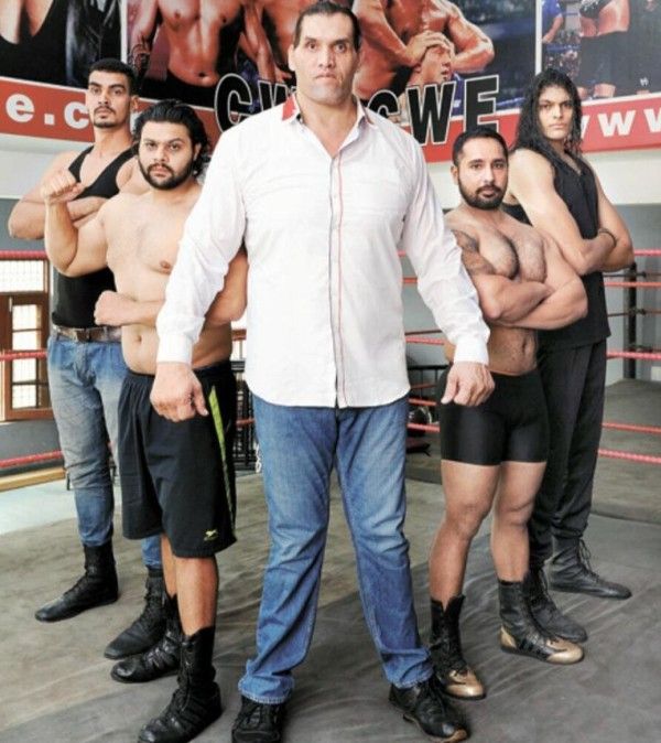 The Great Khali (in shirt) with other wrestlers of CWE
