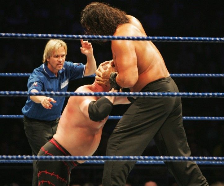 The Great Khali performing Vise Grip move on Kane